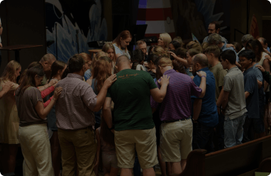 group of people praying together